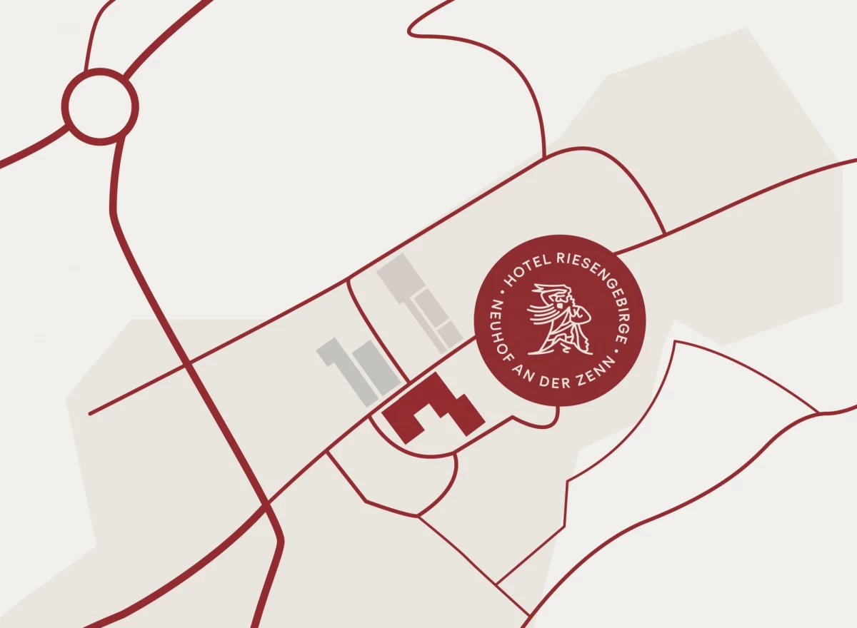 Schematische Karte mit Standortmarkierung für das Hotel Riesengebirge in Neuhof an der Zenn. Rote Linien zeigen Straßen und Wege, mit einem roten Siegellogo des Hotels an einer Schlüsselstelle der Karte.